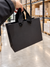 Black paper bag with black ribbon handles
