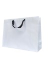 White paper bag with black ribbon handles