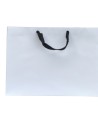 White paper bag with black ribbon handles