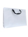 White paper bag with black ribbon handles