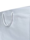 White paper bag with white cord handles
